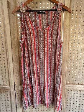 Super cute boho-style sleeveless dress by CURE. Features a beautiful mixed strip